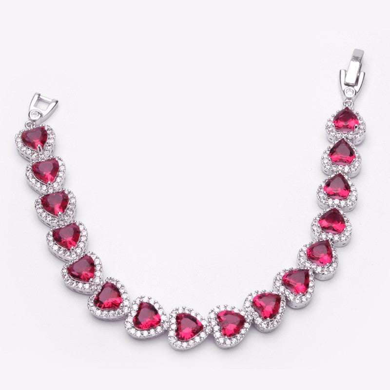 Royal Rhodium Plated Bracelet Encrusted With Red Shiny Heart Shaped Zircon Stones For Women