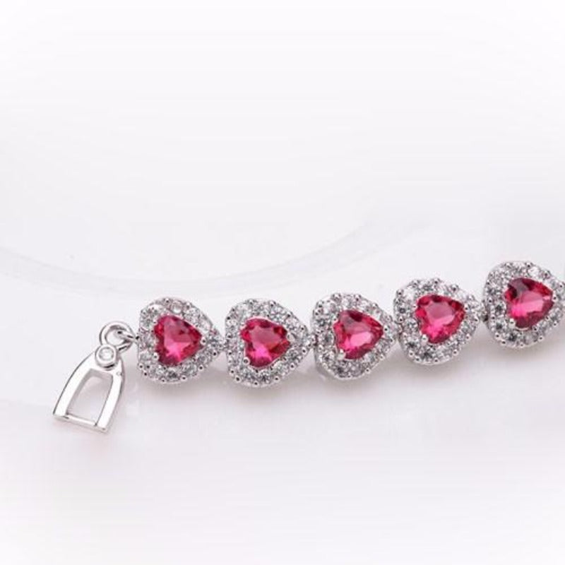 Royal Rhodium Plated Bracelet Encrusted With Red Shiny Heart Shaped Zircon Stones For Women