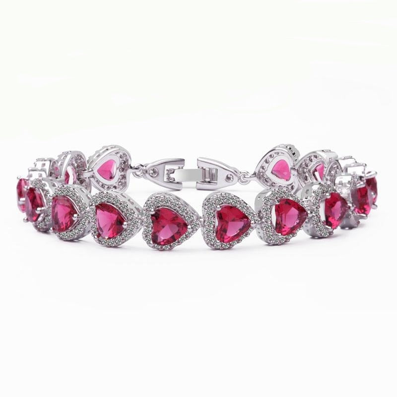 Royal Rhodium Plated Bracelet Encrusted With Red Shiny Heart Shaped Zircon Stones For Women